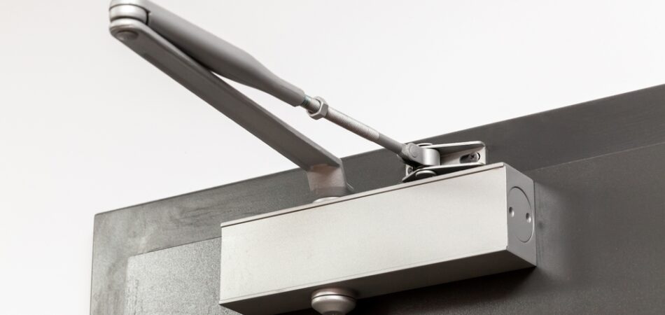 Close Up,showing,a,modern,silver,door,closer,mechanism,,with,its